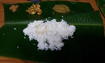 Food served on Banana Leaf. This is a traditional way of serving food more popular in Southern India