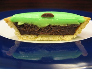 Caracs are Swiss mini tarts with chocolate filling, covered with green icing
