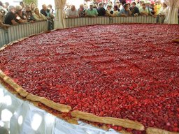Strawberry pie, 8 m in diameter, Beaulieu sur Dordogne, France, during the annual strawberry festival