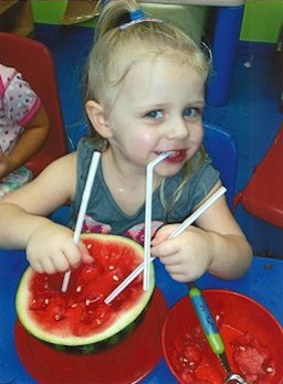 Emelia Rose enjoys a novel way to get all the juice from her watermelon